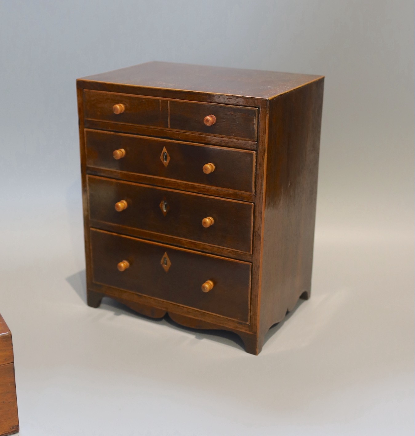 A Victorian rosewood jewellery casket, one other and a 19th century mahogany apprentice chest, height 25cm